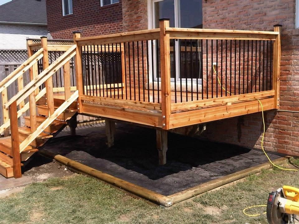 New cedar deck construction at residential property