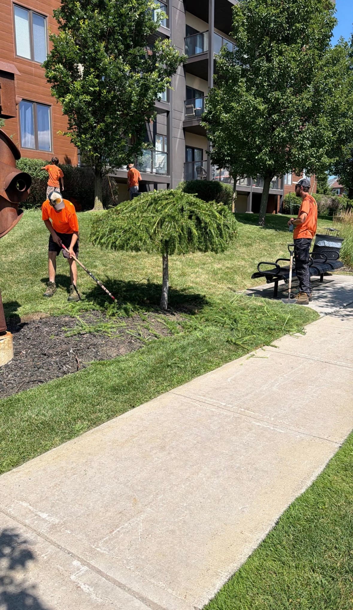 KJS crew maintaining garden beds at condo complex
